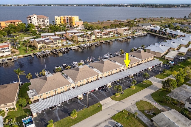 birds eye view of property with a water view