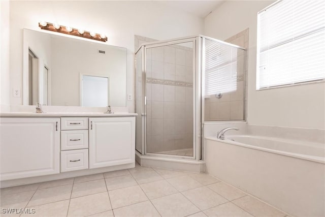 bathroom featuring tile patterned flooring, vanity, and independent shower and bath