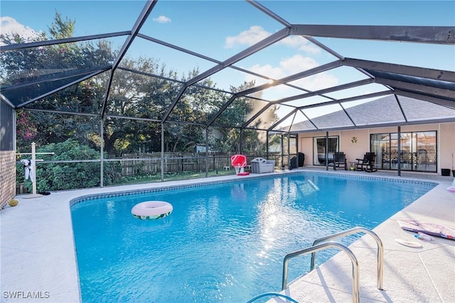 view of pool featuring a patio area and a lanai