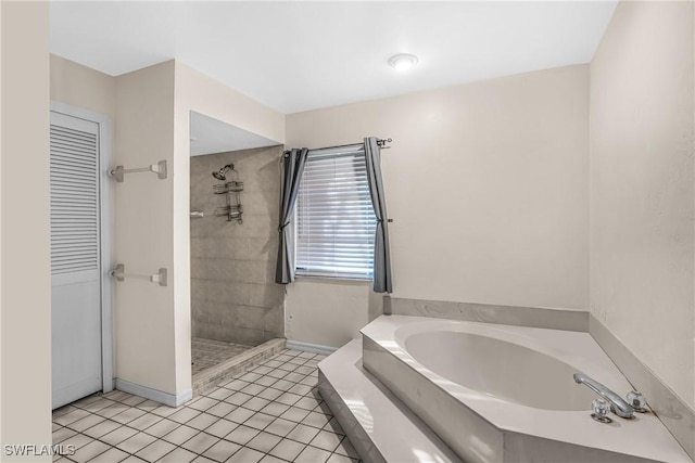 bathroom featuring tile patterned floors and independent shower and bath