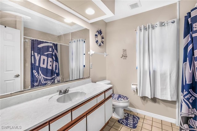 bathroom with tile patterned floors, vanity, and toilet