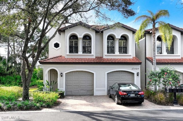 mediterranean / spanish-style house featuring a garage