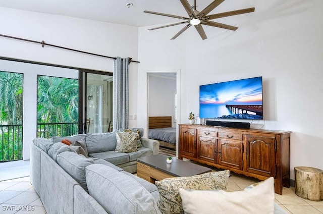 living room with ceiling fan and light tile patterned floors