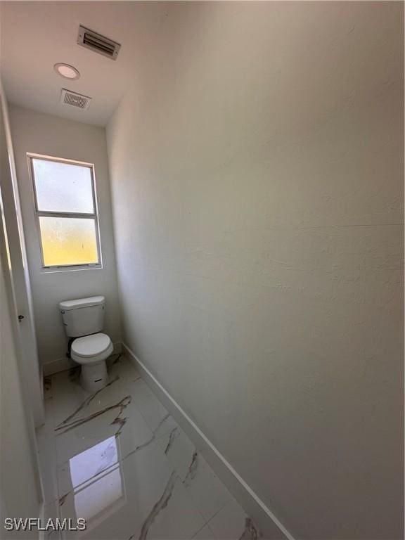 bathroom featuring toilet