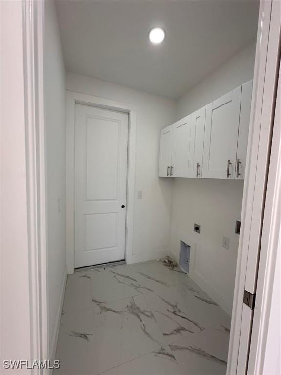 laundry room with cabinets and hookup for an electric dryer