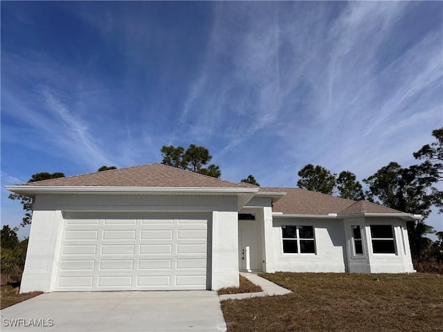 ranch-style home featuring a garage