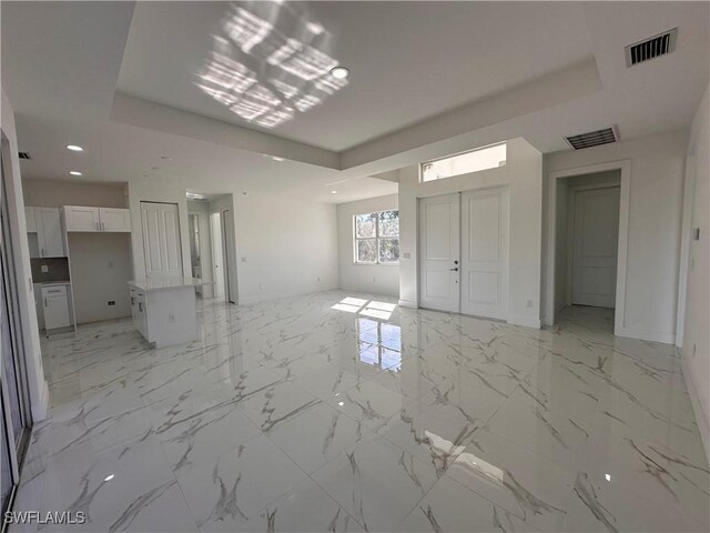 interior space featuring a tray ceiling