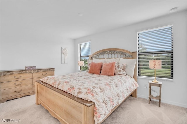 bedroom with light colored carpet