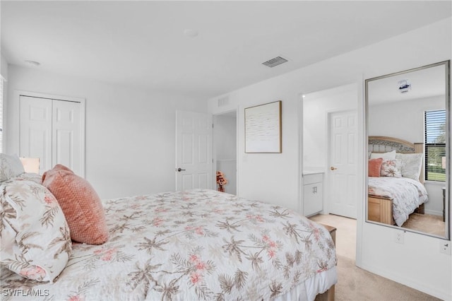 carpeted bedroom with a closet