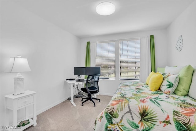 bedroom featuring light carpet