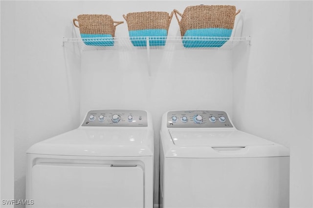 laundry area with separate washer and dryer