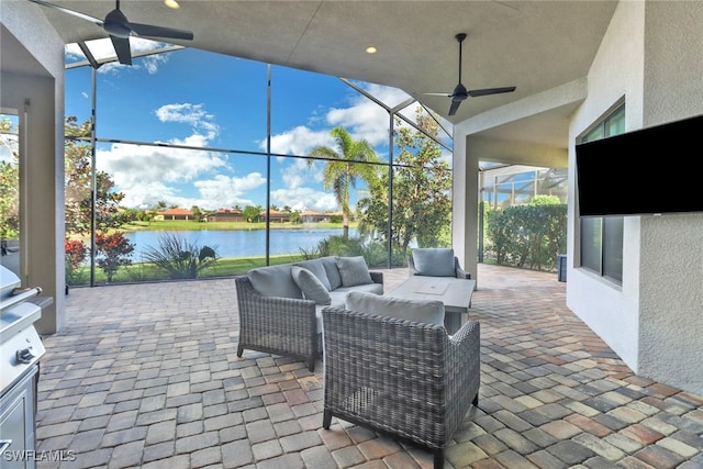 view of patio featuring an outdoor living space, a lanai, and ceiling fan