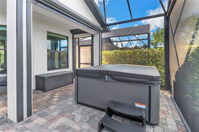 sunroom with a hot tub and lofted ceiling