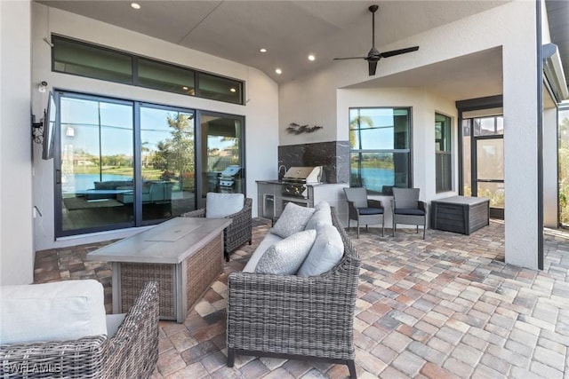 view of patio with an outdoor living space, ceiling fan, and area for grilling