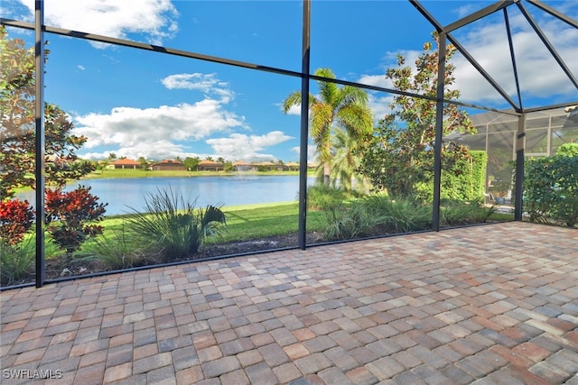 unfurnished sunroom with a water view