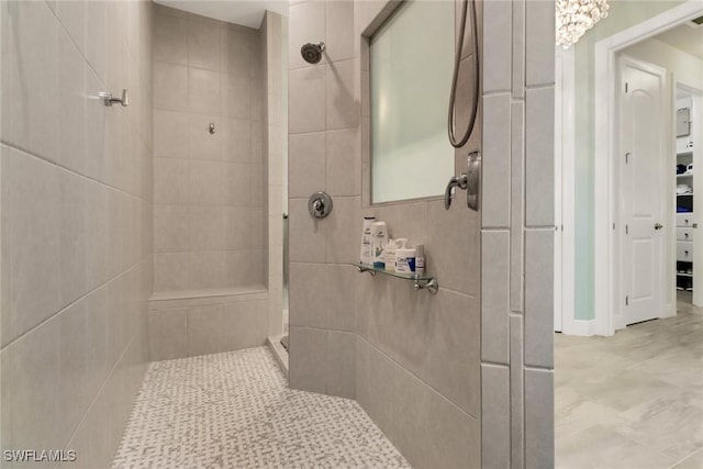 bathroom with a tile shower