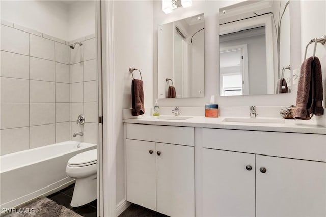 full bathroom with vanity, toilet, tile patterned floors, and tiled shower / bath combo