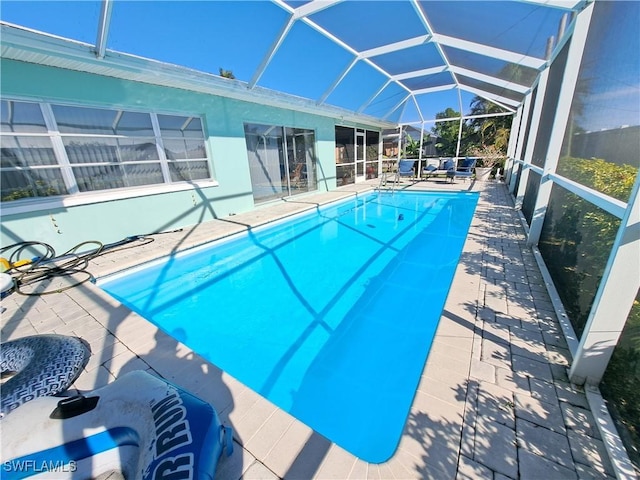 view of pool featuring a lanai and a patio area