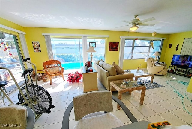 tiled living room featuring ceiling fan