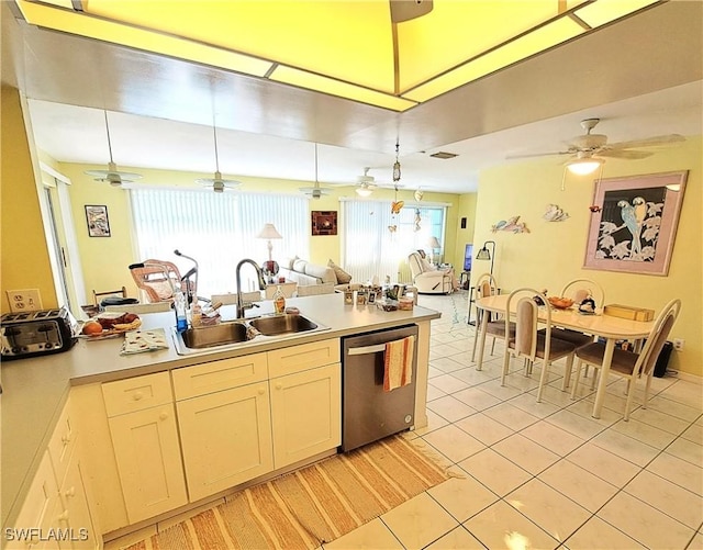1727 Lakeview Blvd, North Fort Myers, FL 33903 - kitchen featuring dishwasher, a sink, light tile patterned flooring, and light countertops