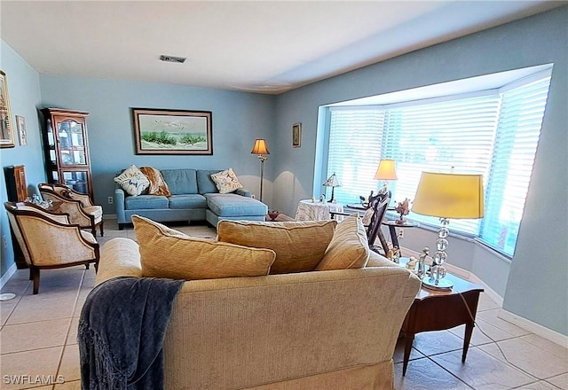 1727 Lakeview Blvd, North Fort Myers, FL 33903 - living area with light tile patterned floors, plenty of natural light, and baseboards