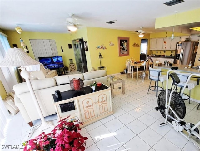 1727 Lakeview Blvd, North Fort Myers, FL 33903 - living room featuring ceiling fan and light tile patterned floors