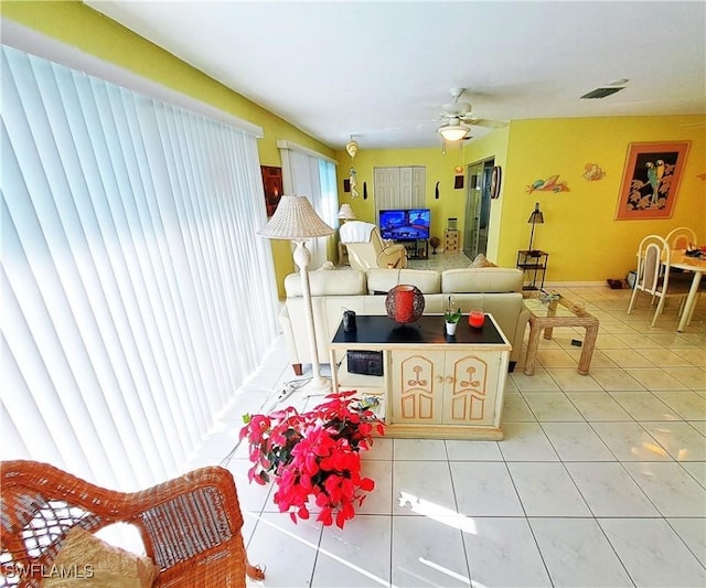 1727 Lakeview Blvd, North Fort Myers, FL 33903 - living area featuring light tile patterned floors and ceiling fan
