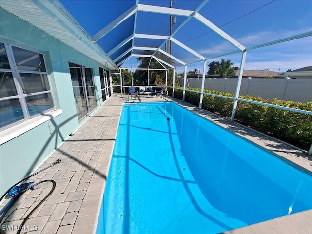 1727 Lakeview Blvd, North Fort Myers, FL 33903 - view of pool featuring a patio area, glass enclosure, and fence