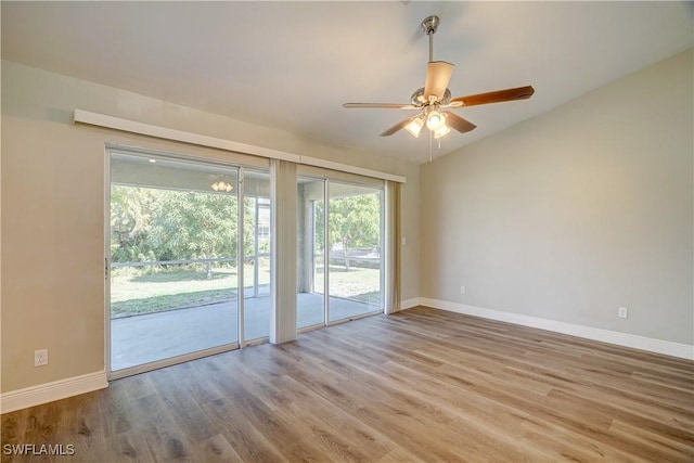 empty room featuring ceiling fan and light hardwood / wood-style floors