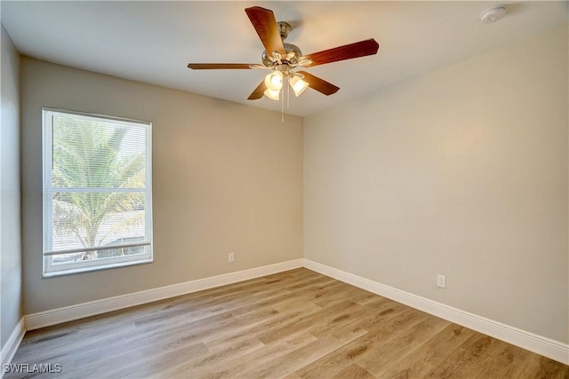 unfurnished room featuring ceiling fan and light wood-type flooring