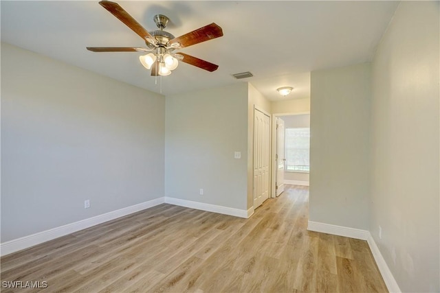 unfurnished room with ceiling fan and light wood-type flooring