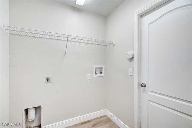 laundry area with hookup for an electric dryer, washer hookup, and hardwood / wood-style flooring