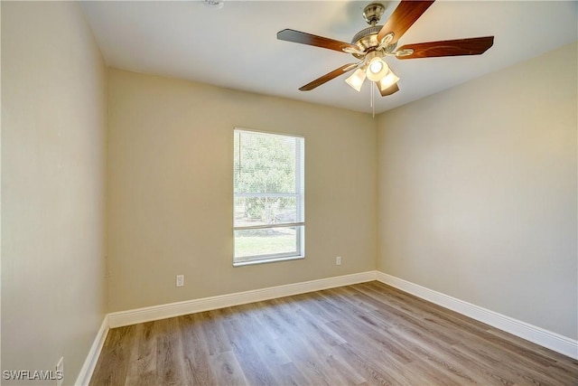 spare room with light hardwood / wood-style flooring