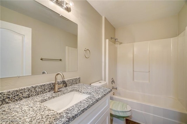 full bathroom featuring vanity, shower / bathing tub combination, and toilet