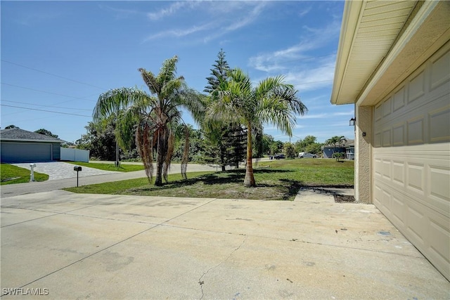 view of yard with a garage