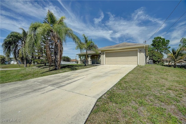 ranch-style house featuring a front yard and a garage