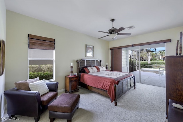 carpeted bedroom featuring access to exterior and ceiling fan