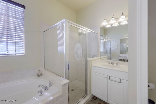 bathroom with vanity and independent shower and bath