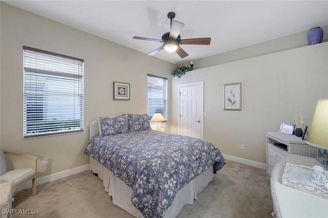 bedroom with light carpet and ceiling fan