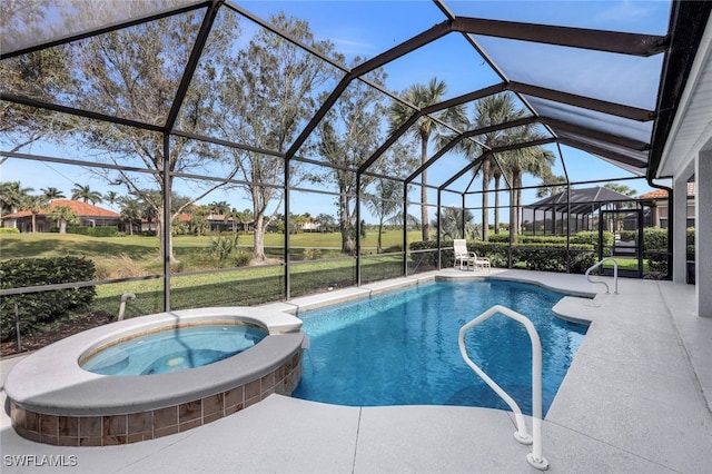 view of pool with a patio area, a lawn, glass enclosure, and an in ground hot tub