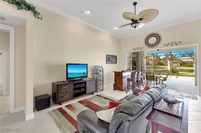 living room with ceiling fan, ornamental molding, and light tile patterned floors