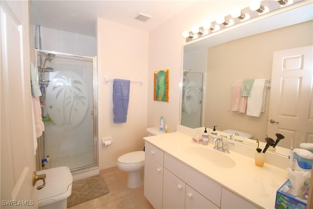 bathroom featuring tile patterned floors, vanity, toilet, and walk in shower