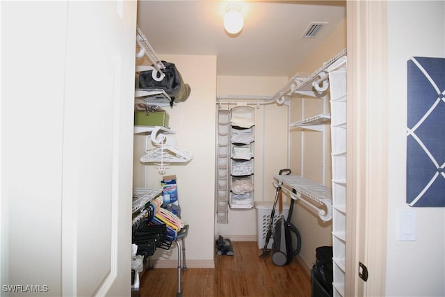 4009 Palm Tree Blvd Unit 403, Cape Coral, FL 33904 - walk in closet with visible vents and wood finished floors