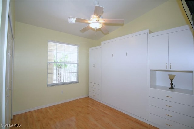 4009 Palm Tree Blvd Unit 403, Cape Coral, FL 33904 - unfurnished bedroom with baseboards, ceiling fan, and light wood-style flooring