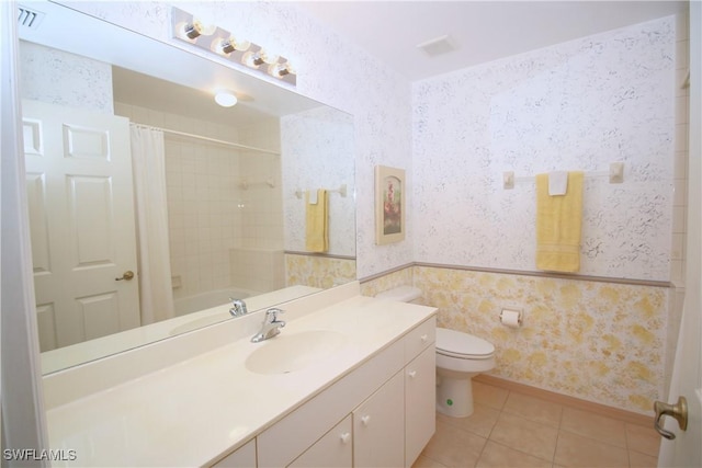 4009 Palm Tree Blvd Unit 403, Cape Coral, FL 33904 - bathroom with visible vents, tile patterned flooring, vanity, toilet, and wallpapered walls
