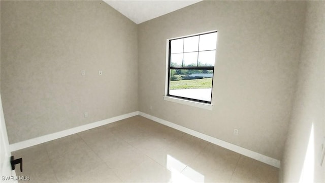 tiled spare room with baseboards