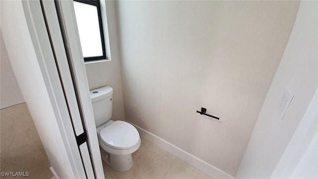 bathroom featuring tile patterned floors and toilet