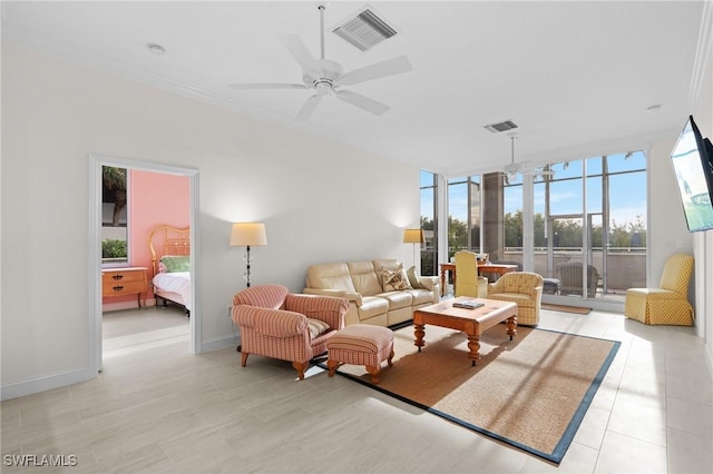 living room with ceiling fan and expansive windows