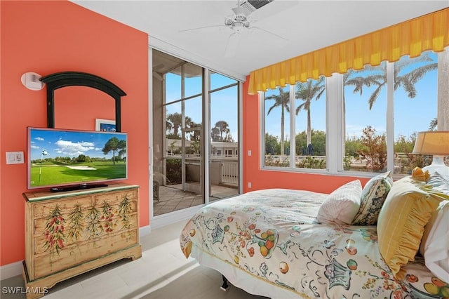 bedroom featuring access to outside, multiple windows, and ceiling fan