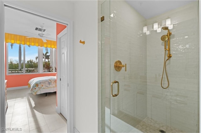 bathroom with tile patterned flooring, walk in shower, and ceiling fan